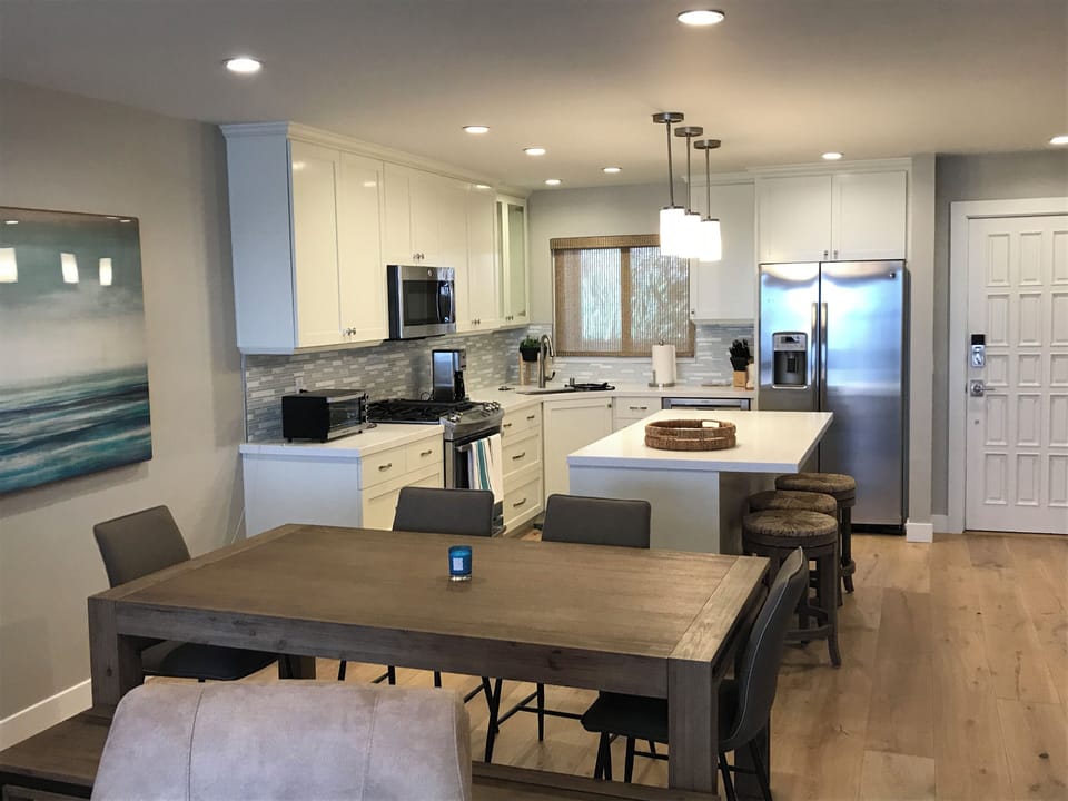 distressed hard wood floors throughout.  Inside dining area and kitchen bar.