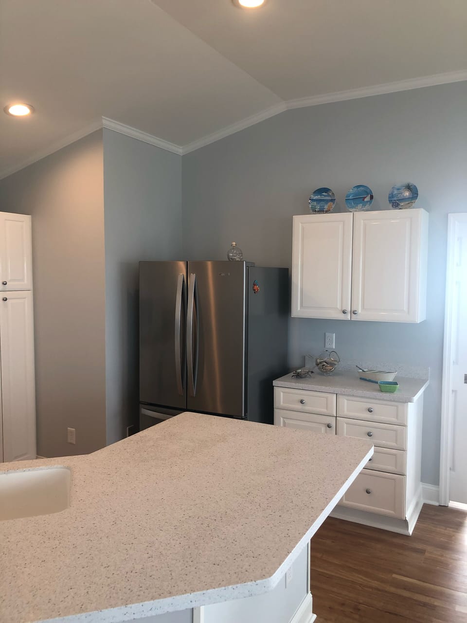 Kitchen with new stainless refrigerator