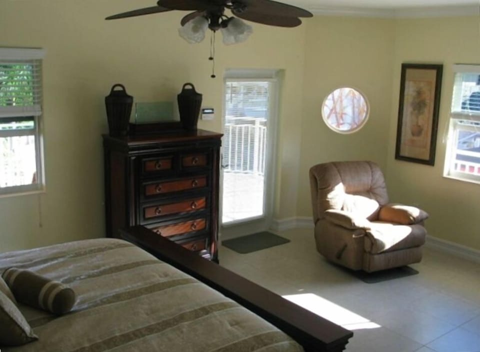 'The Palm Room' East Master Bedroom (King Bed w/Master Bath) with door to porch.