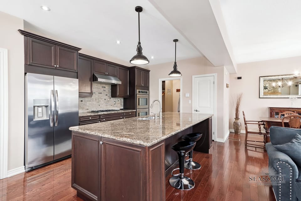 Fully stocked Chef's kitchen with 5 burner gas range and dual convection oven