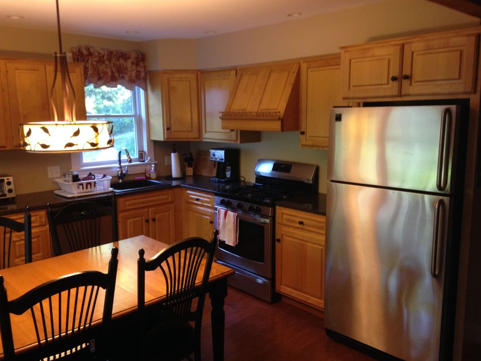 Granite counter tops, Birch-wood cabinetry and stainless steel appliances.
