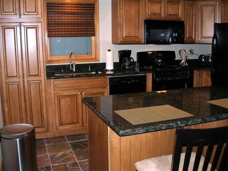 Granite countertops/ new cabinets/ slate floor/ all new appliances/ gas stove