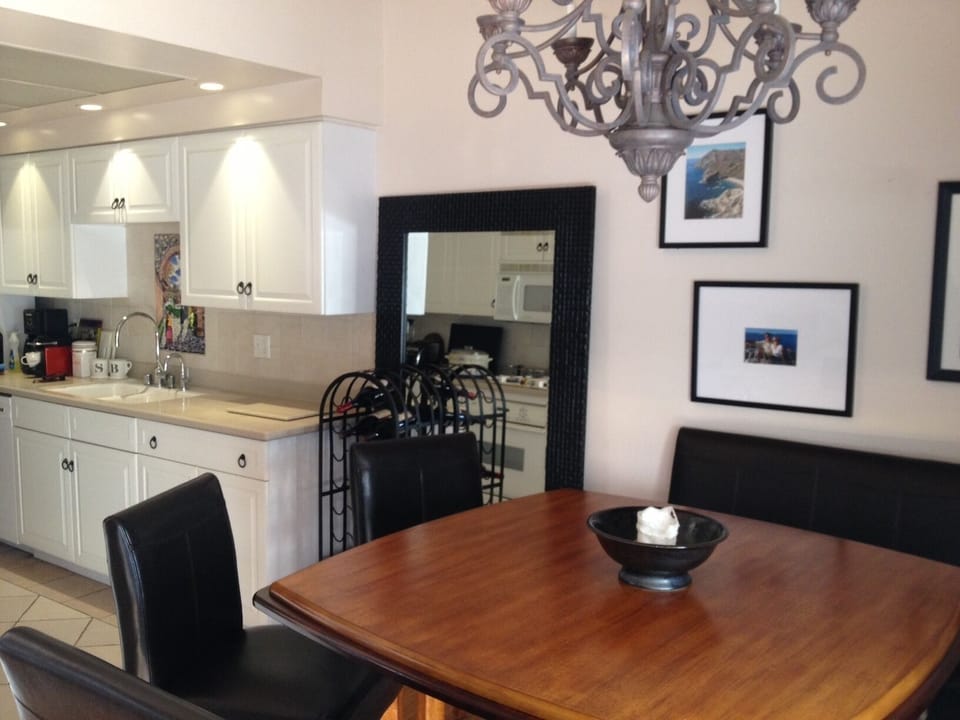 dining area and kitchen with tavern style dining seating for 8