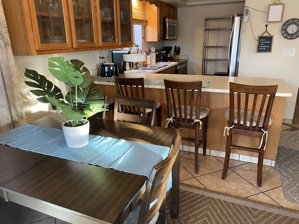 Kitchen table can seat up to 8 people while 4 more guests can sit at the counter