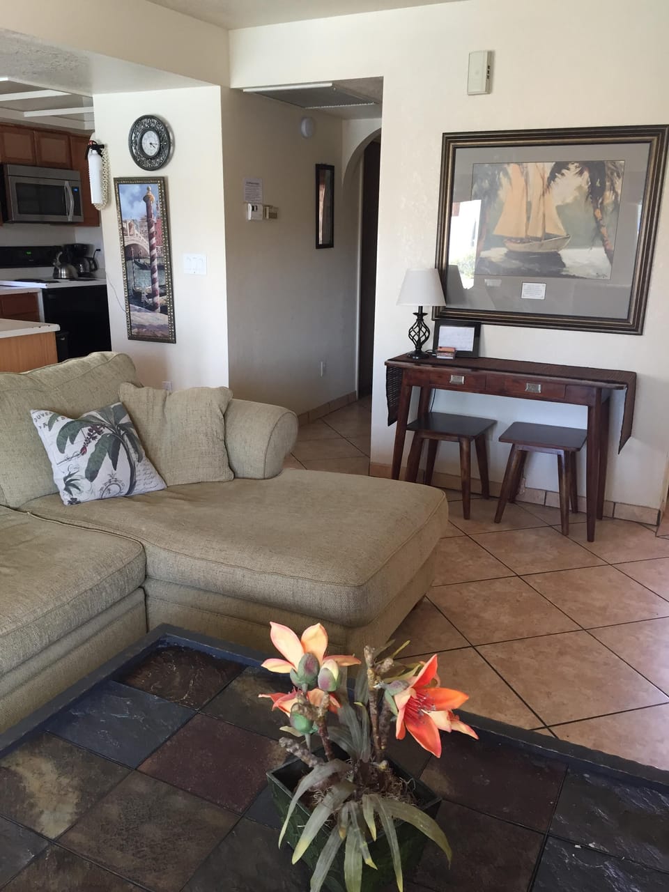 Living room leads to a hall with one bedroom and full guest bathroom.