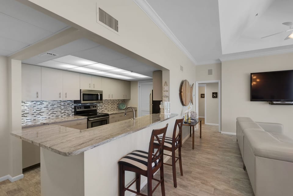 Gorgeous kitchen is open to living and dining area.