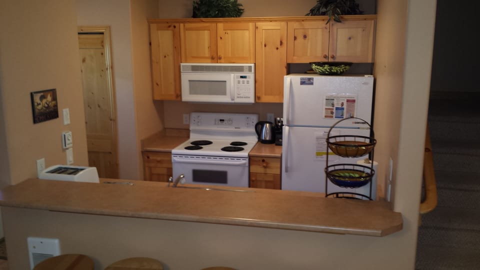 Kitchen with eating bar.