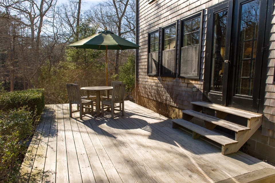 Sunny and private deck with views of woodland.
