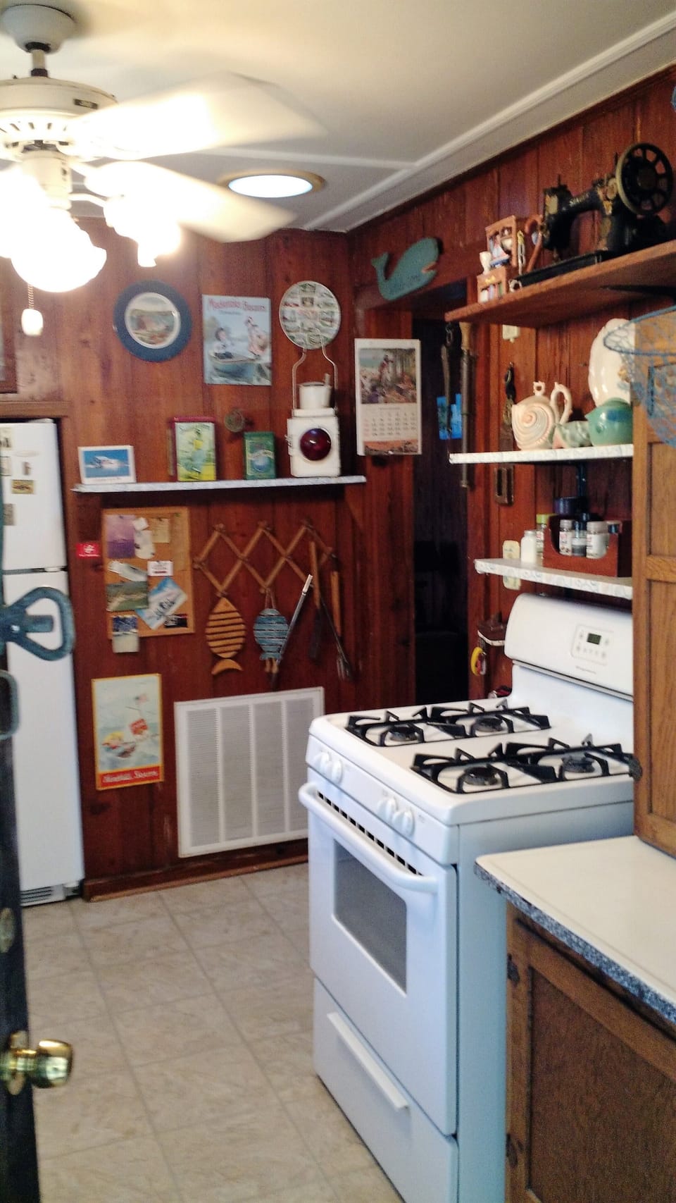 Fully furnished kitchen, stove, refrigerator, microwave, pots, pans, etc