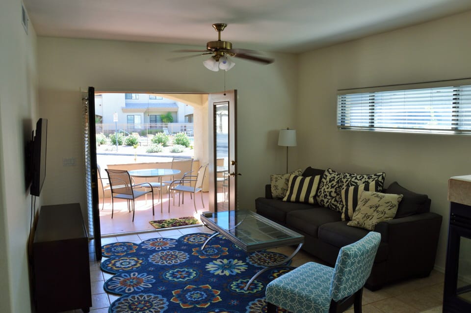 French Doors open to patio for easy entertaining, dinner/drinks, or enjoy the TV 