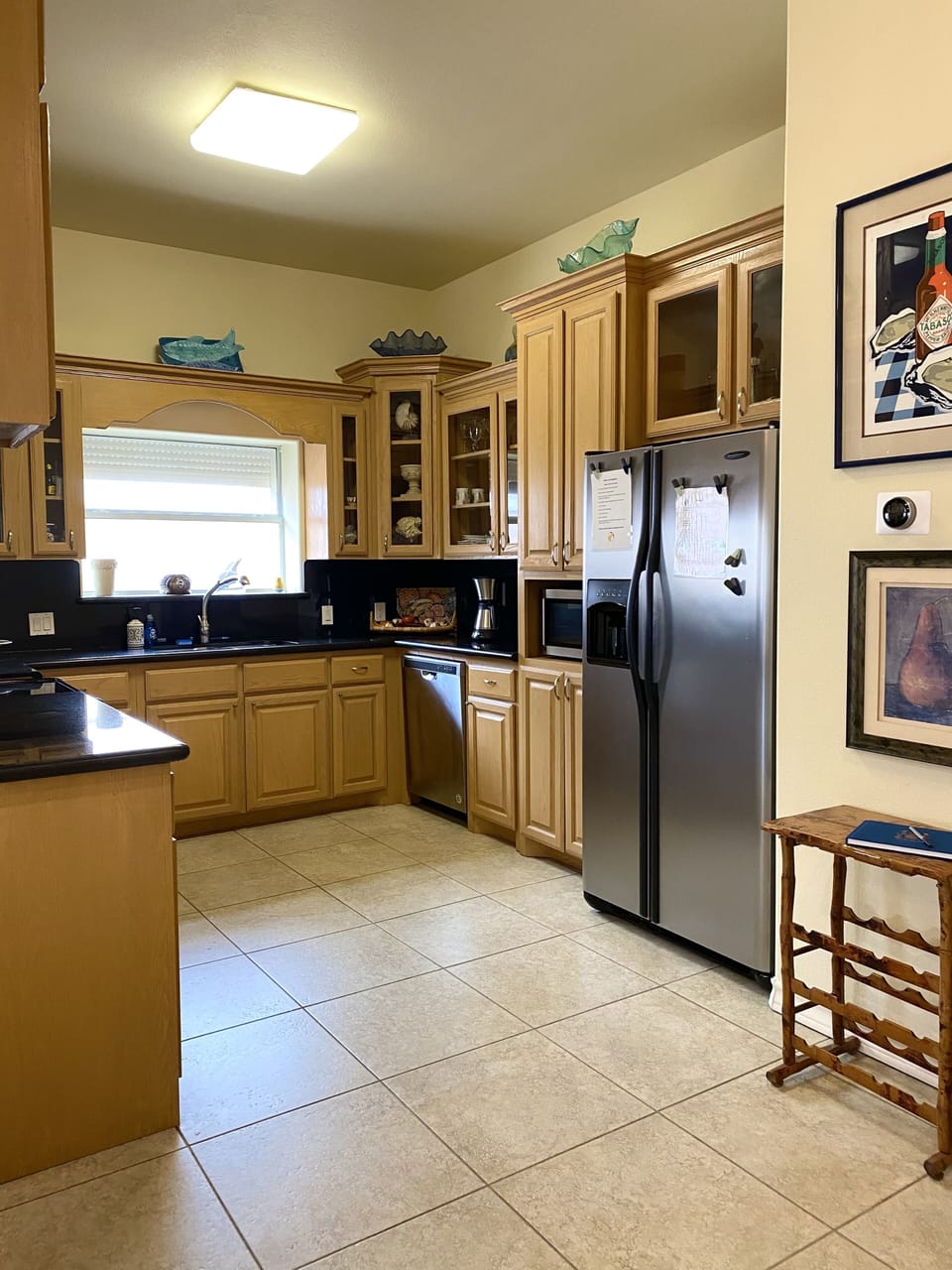 Kitchen has everything you need to cook and serve a meal.