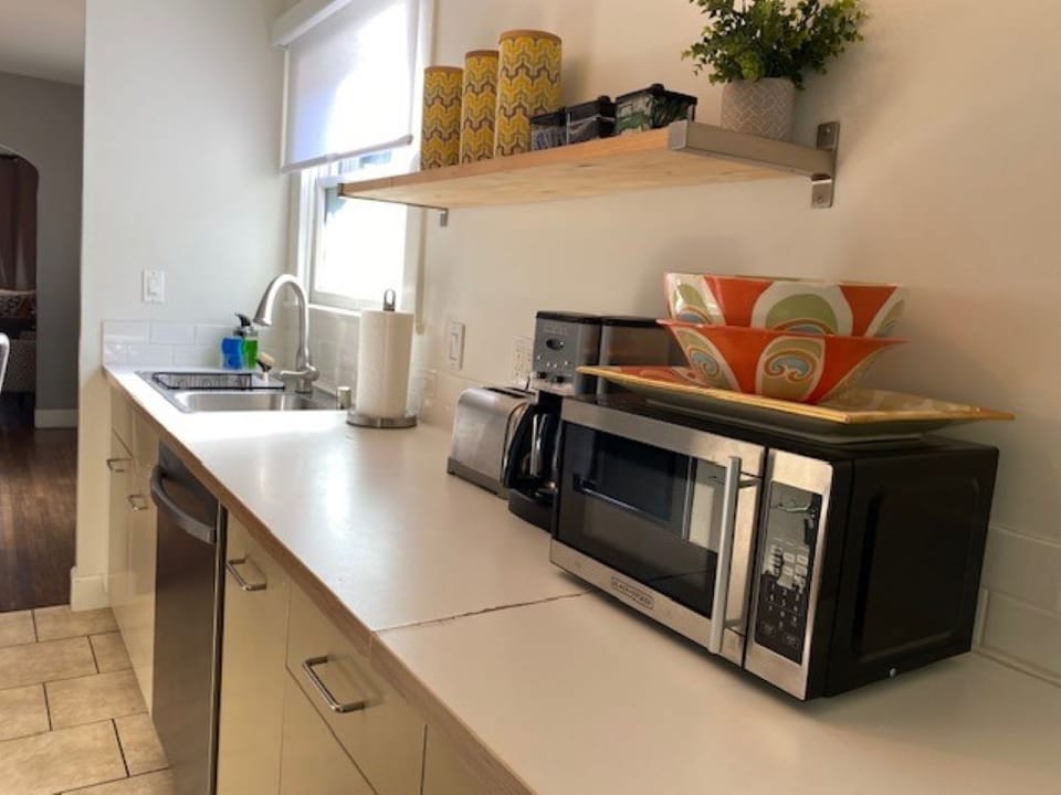 Kitchen area with microwave, coffee, toaster, etc. 