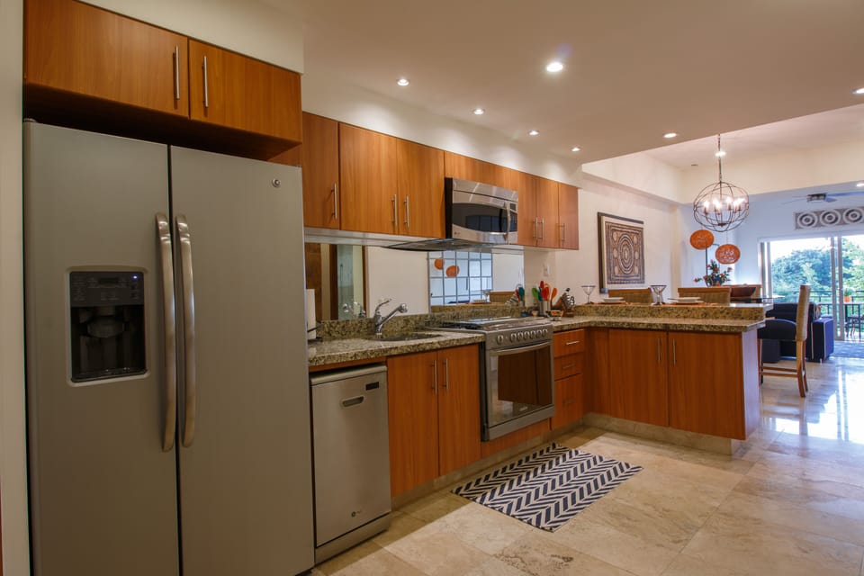 Large,open concept kitchen with full size refrigerator, stove and oven