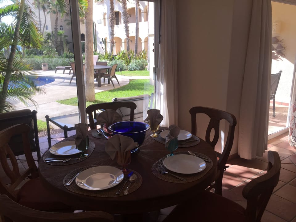 View of pool from dining room. Beach is only 100 steps away!