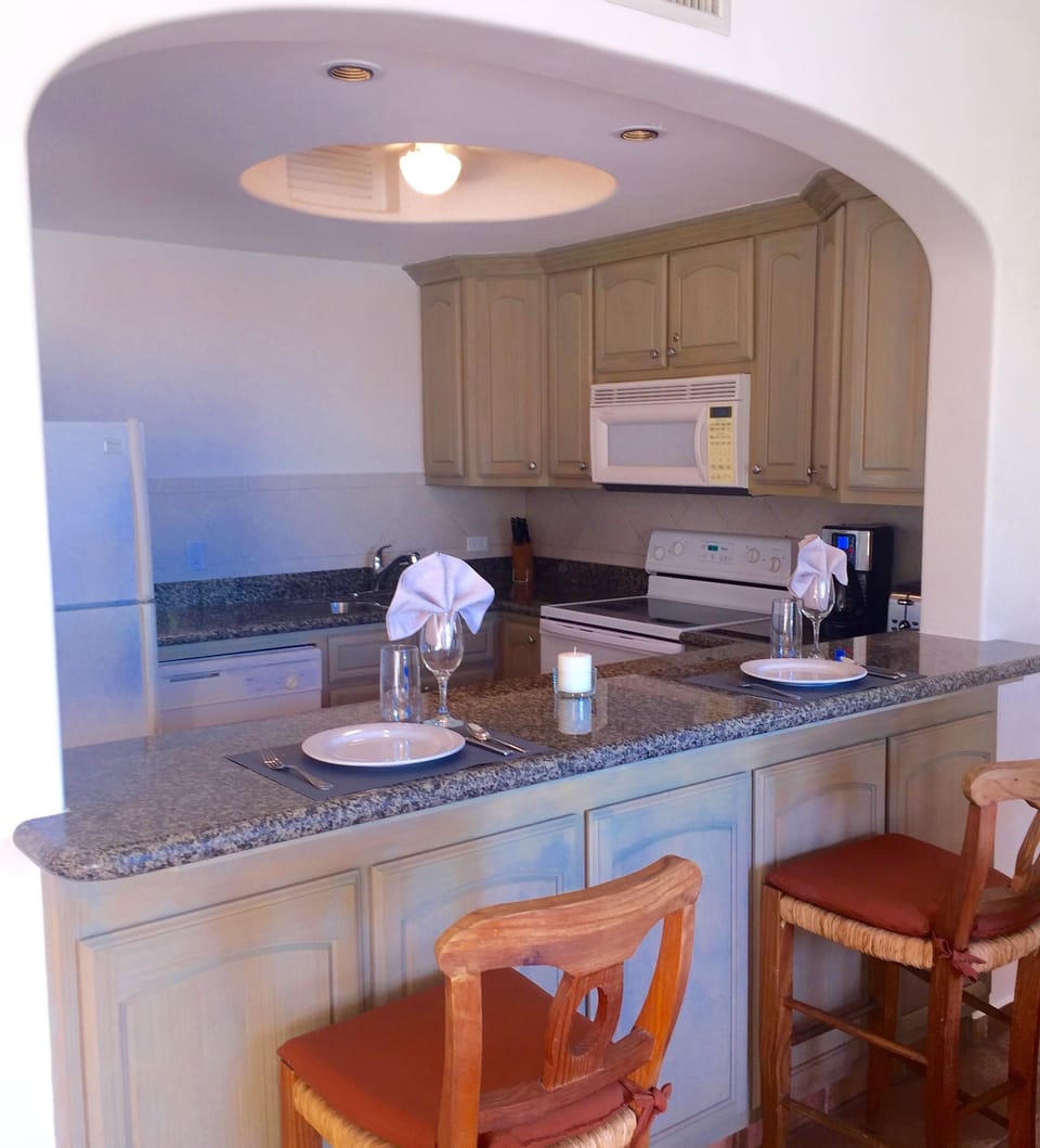 Fully equipped kitchen with granite, full sized appliances and beautiful views