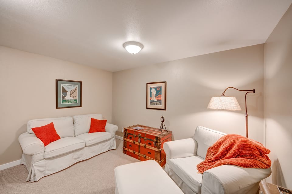Lower level lounge includes a flat screen TV. 