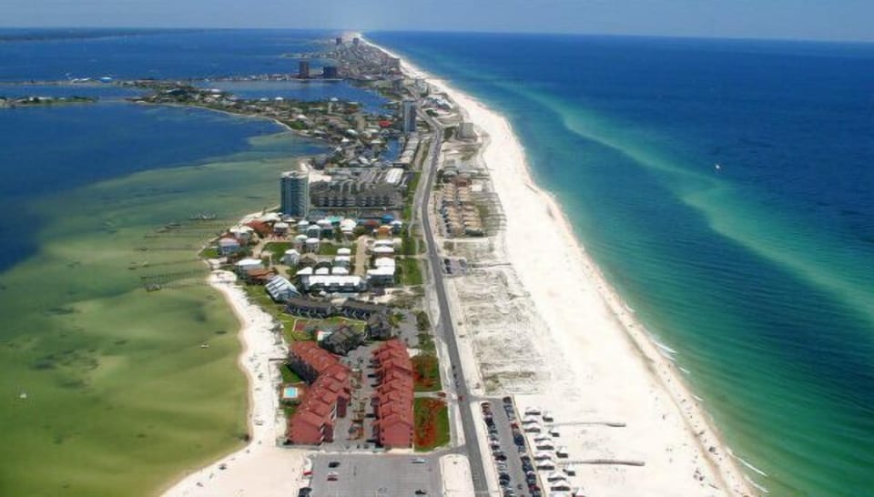 Looking East down the beach from west end - deep water access to Lafitte Cove.