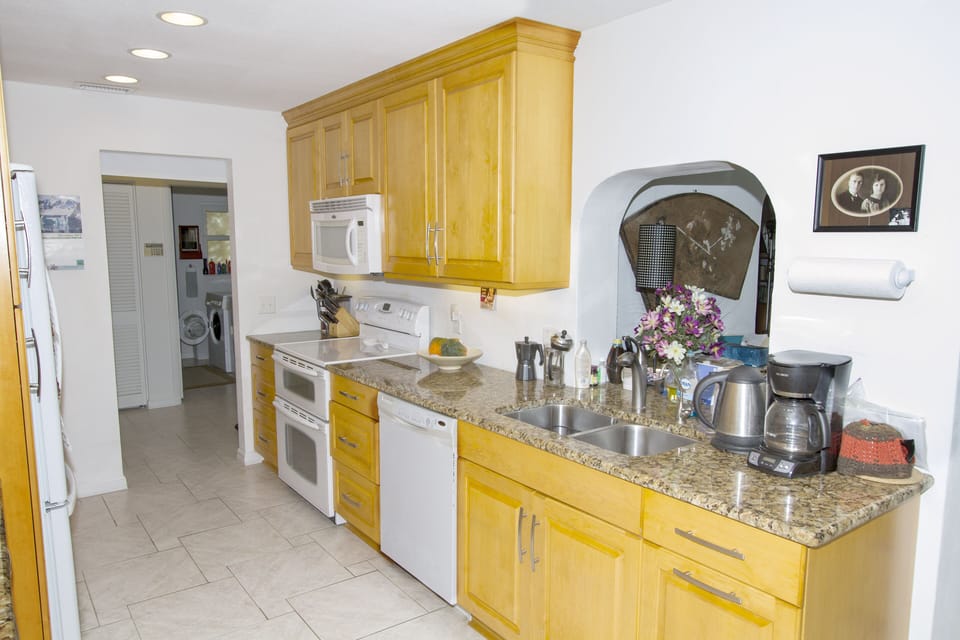 Kitchen with lovely granite counter tops, split oven, dishwasher, microwave #1