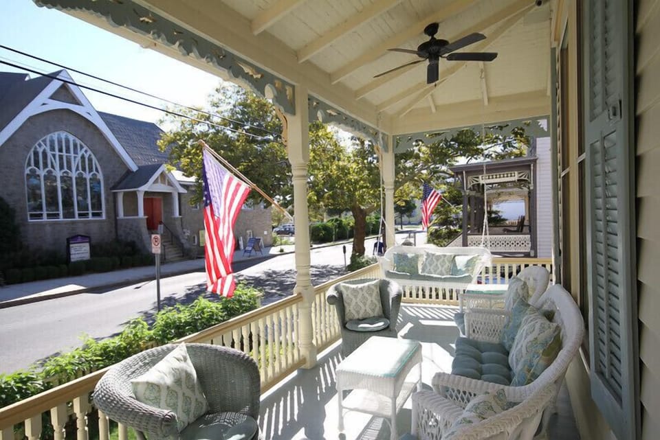Watch horse and buggies, trolleys and more pass as you sit on the lovely porch