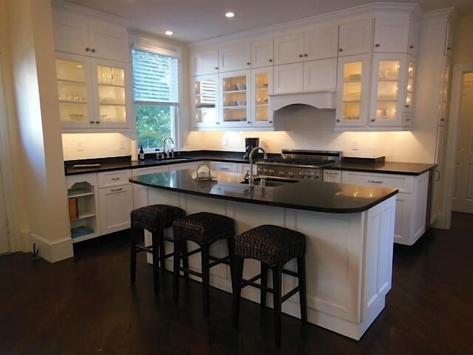 Gourmet Kitchen fully stocked with kitchen tools, dishware and flatware
