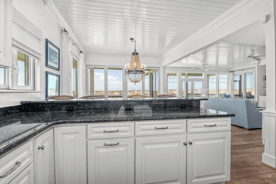Beautiful views and natural light fill the kitchen, dining and living areas.