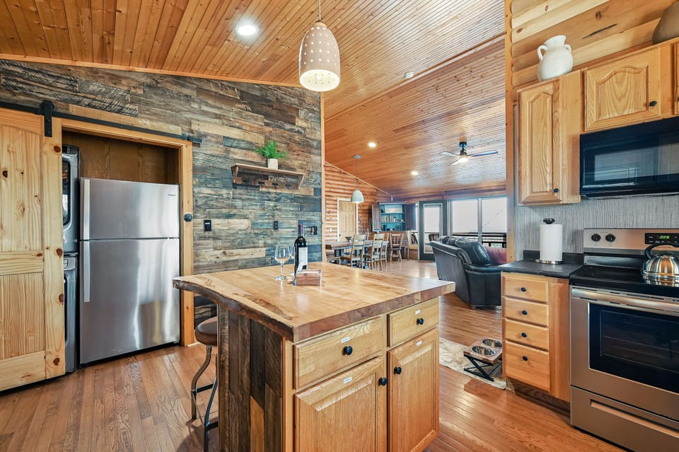 View of kitchen into living room and dining table