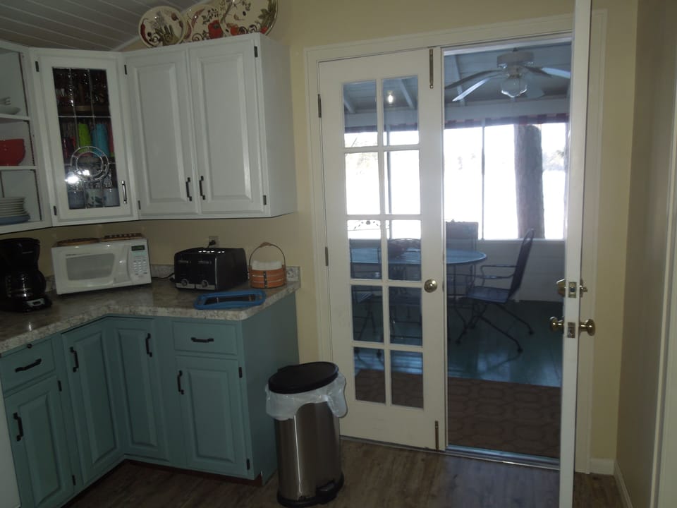 Kitchen leading to screened porch