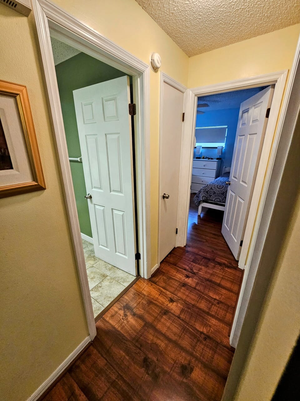 View into hall bathroom and queen room 