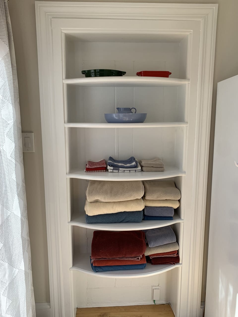 Towel shelf nook in converted back door