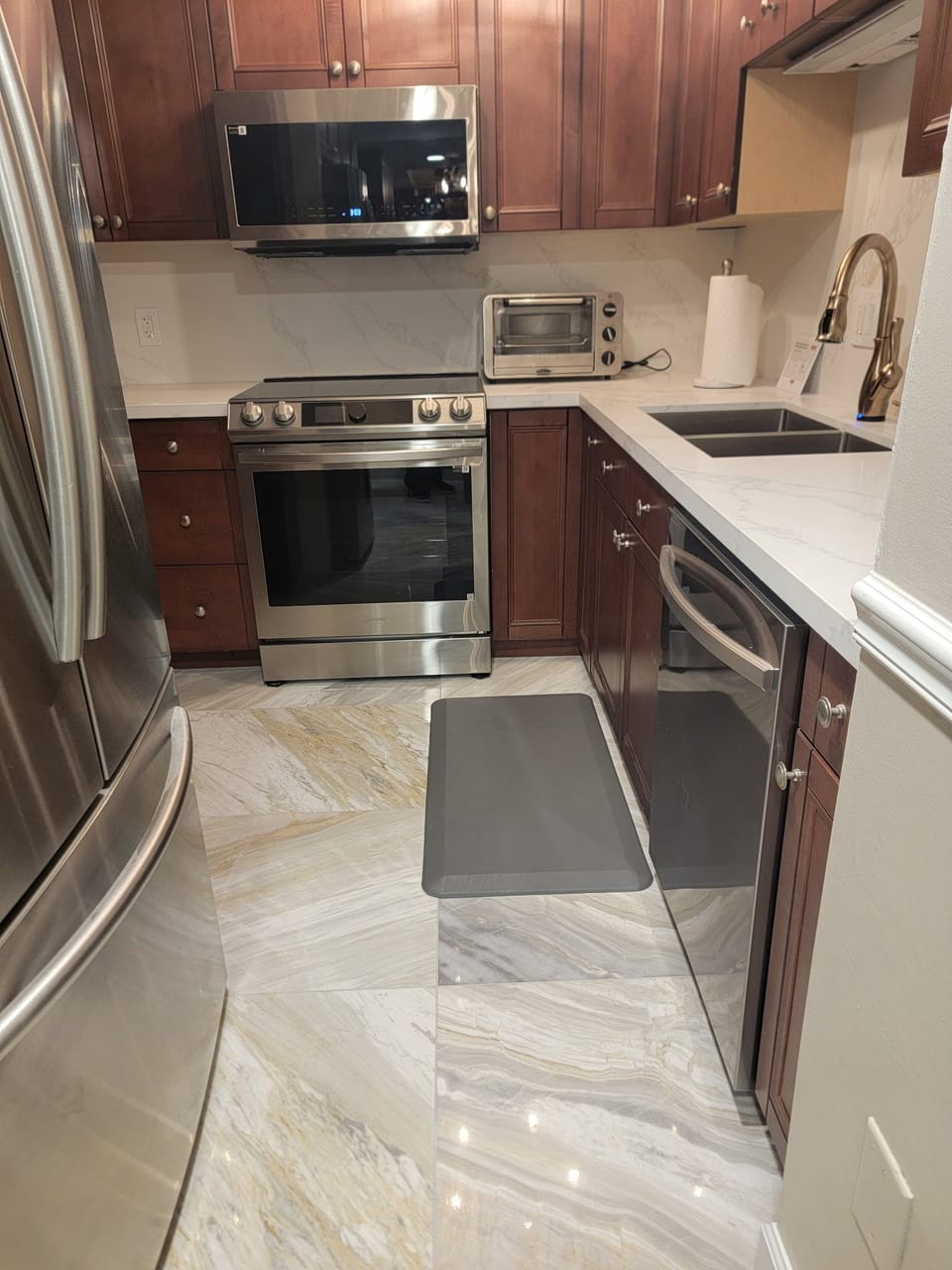Quartz countertops & backsplash, marble floors