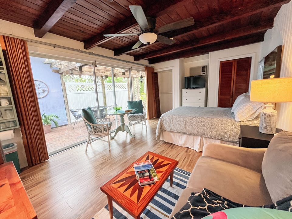 Full-sized bed and ample seating for inside and outside dining.