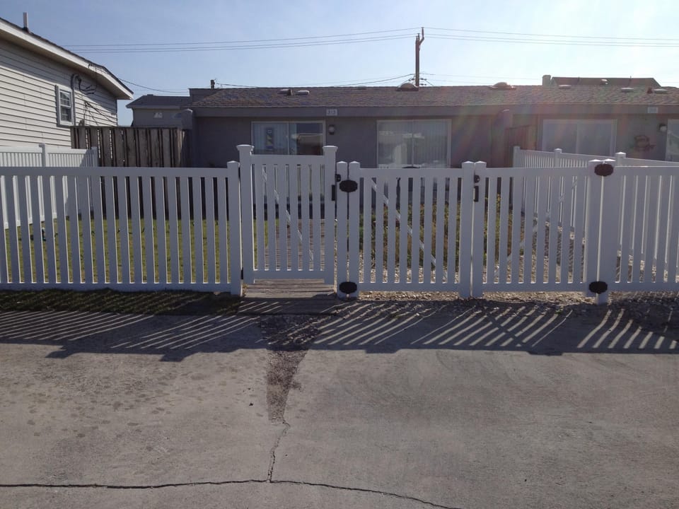 Fenced courtyard and parking spaces