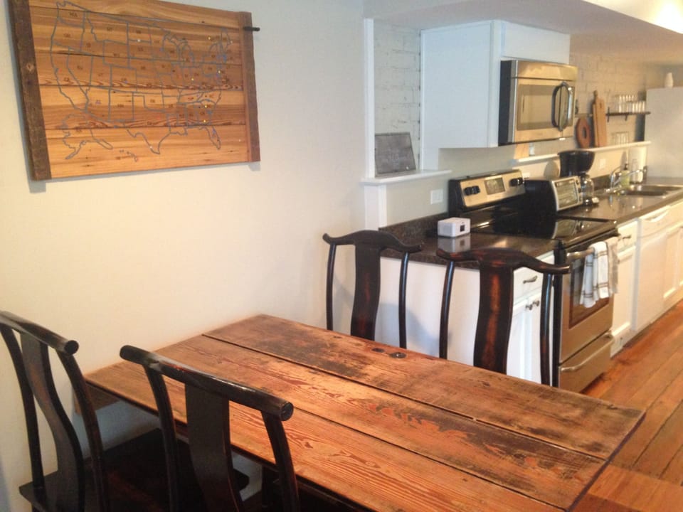 Dining table folds up to the wall if you need more space.