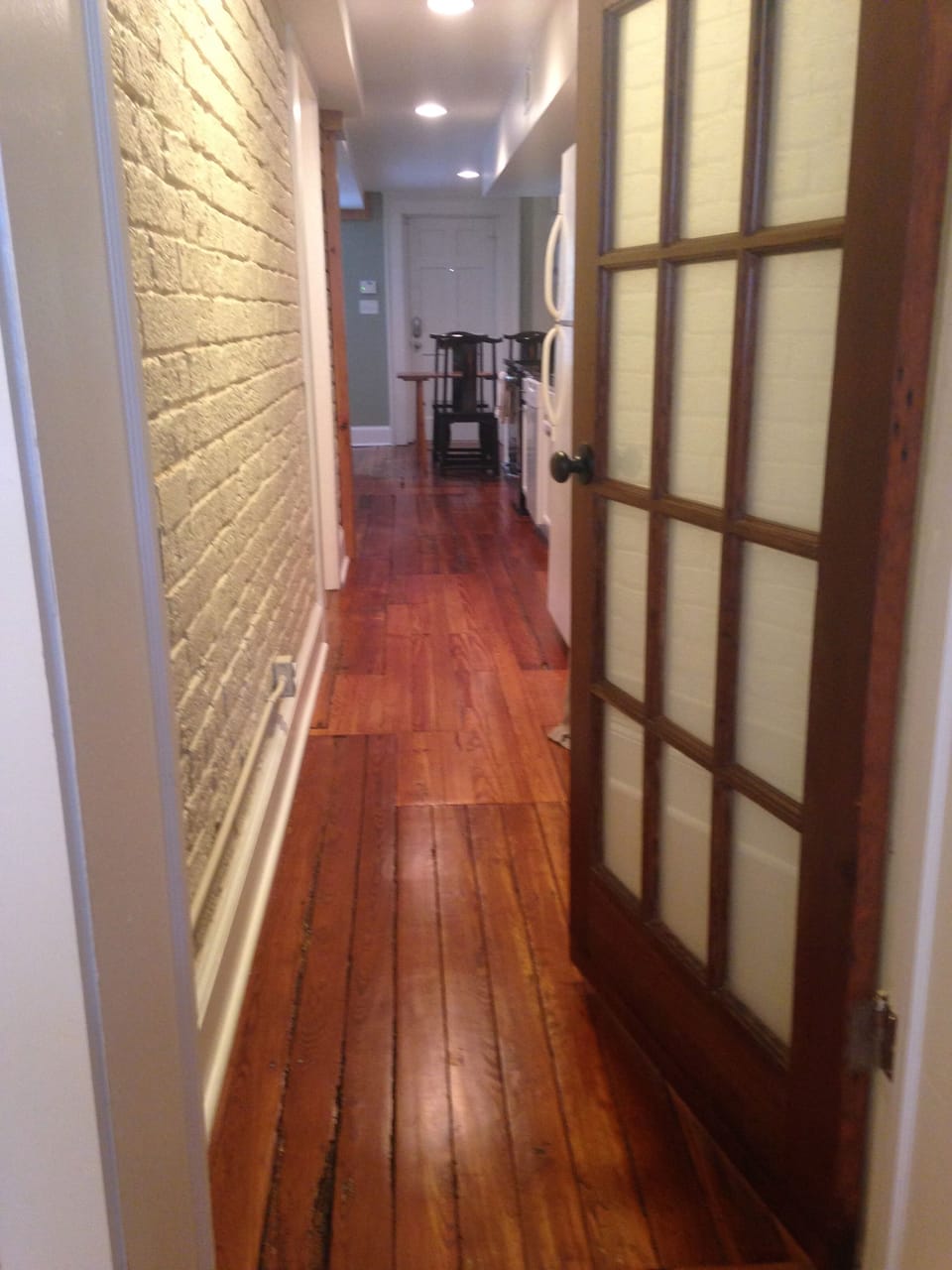 View from master bedroom to living room and kitchen.