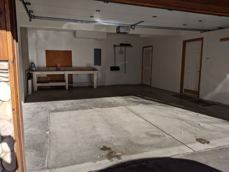 Oversized heated double garage. Large work bench for ski repair. 