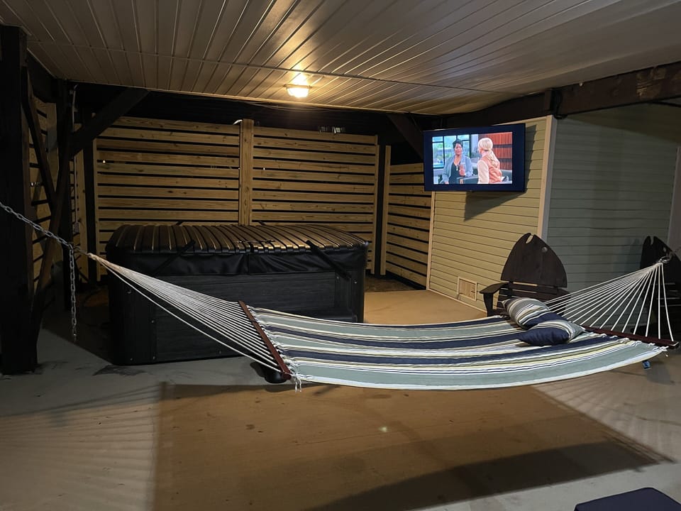 58” Outdoor TV with Dish Network and Netflix. Two more hammocks ordered.