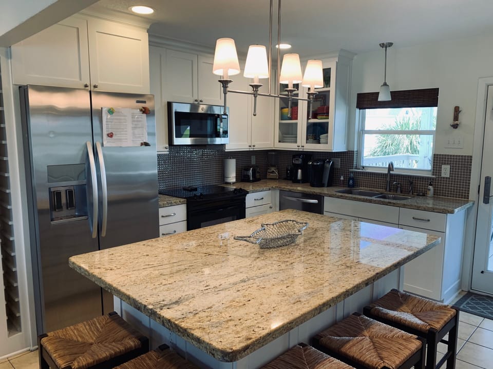 Stainless steel appliances, granite counter tops, pantry & washer/dryer.