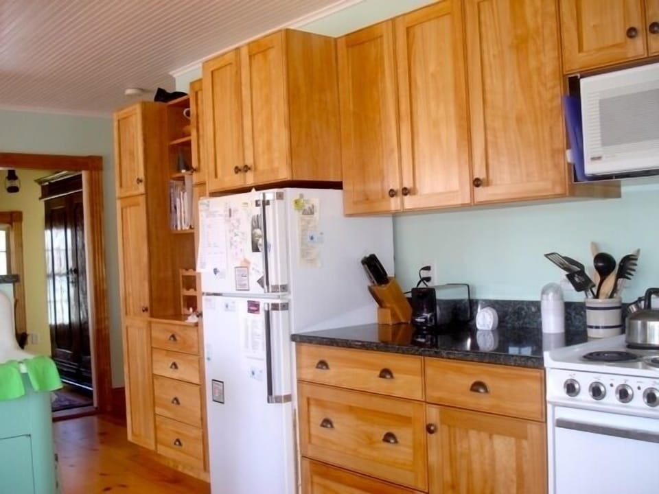Beautiful red birch cabinetry and granite counter tops.