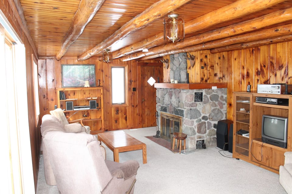 Stunning Knotty Pine Interior with Hand Cut Stone Fireplace