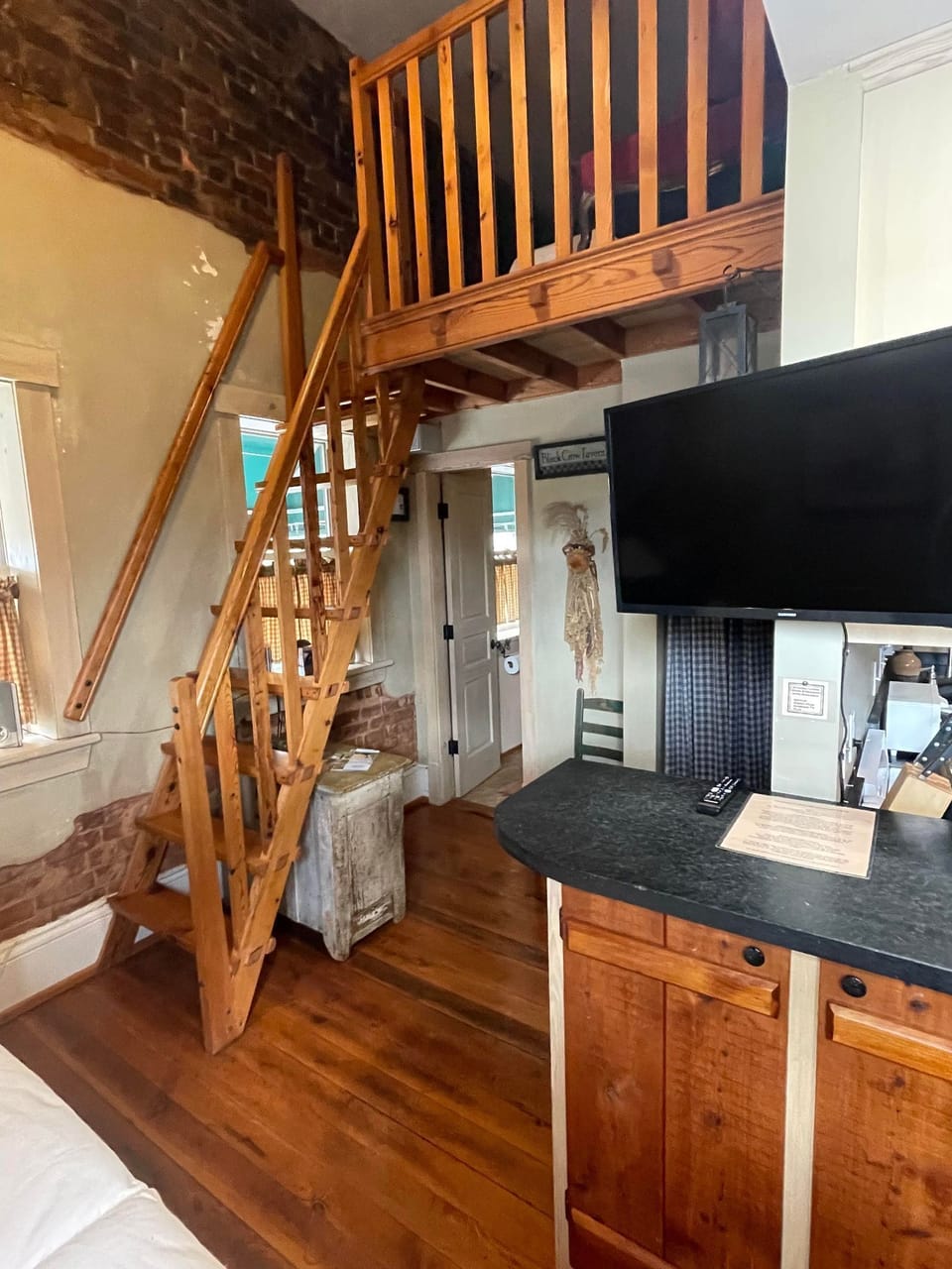 Hand-crafted ladder into the loft.
