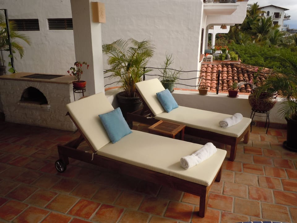 Relax and watch the sunset over the Marietta islands on the lounge chairs