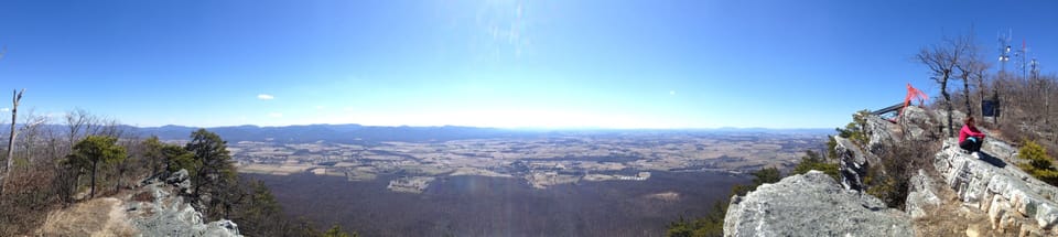panoramic view of valley from hang gliding platform at the top of the ski slopes