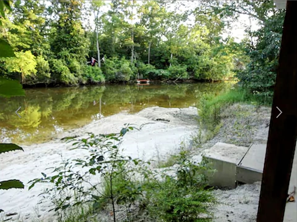 Amenity #9 At Low tides a small beach at the River's edge (Sandbar @ high tide)
