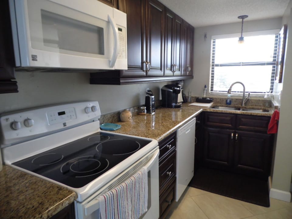 Kitchen: Electric stove, Microwave, Dishwasher, and Keurig Coffeemaker