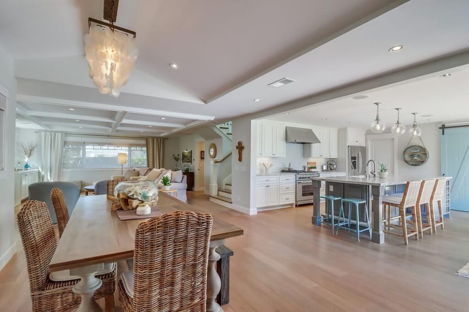 Dining room table seats 6-7. Grand kitchen island seats another 5. 
