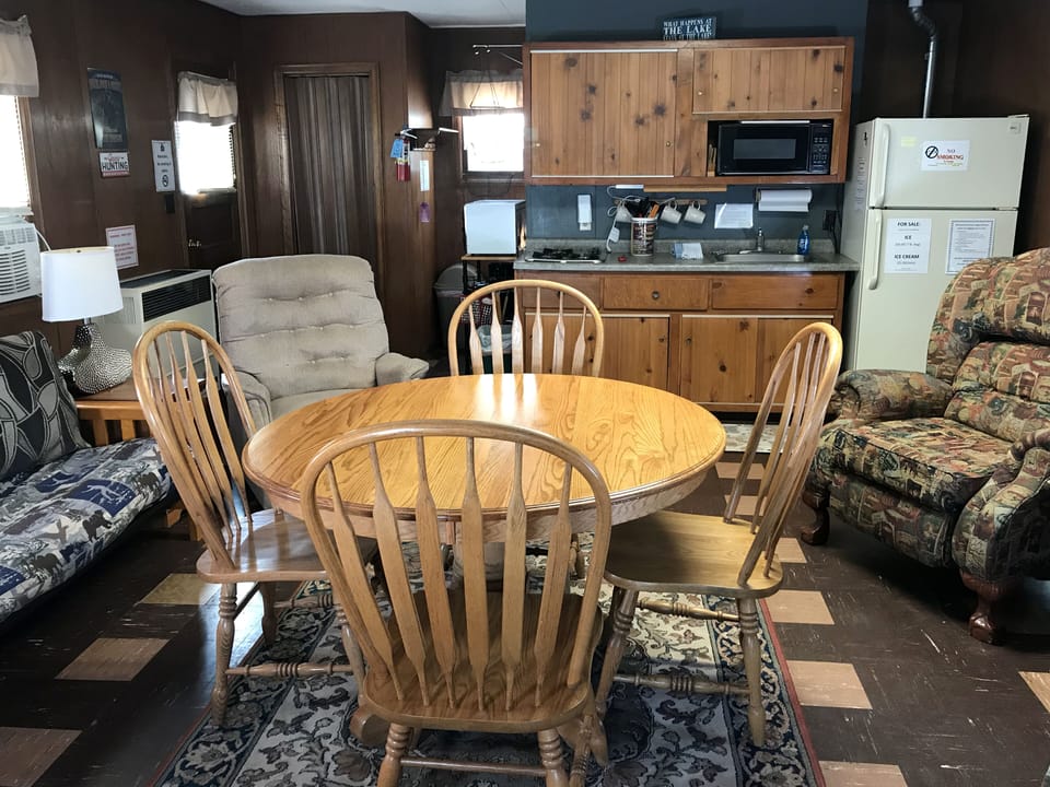 Kitchenette, dining area, futon, and twin bed.