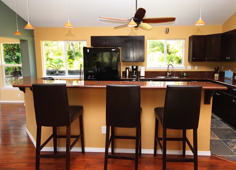 A fully equipped Kitchen and bar area