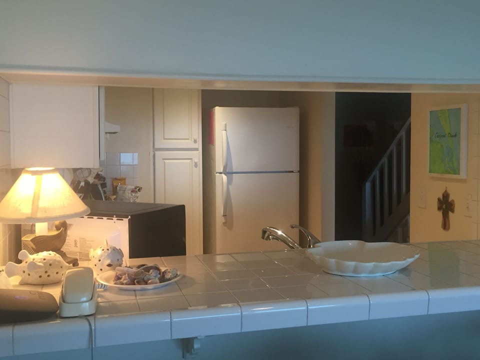 Kitchen with Pass Through Counter to Dining Area on Second Floor.  