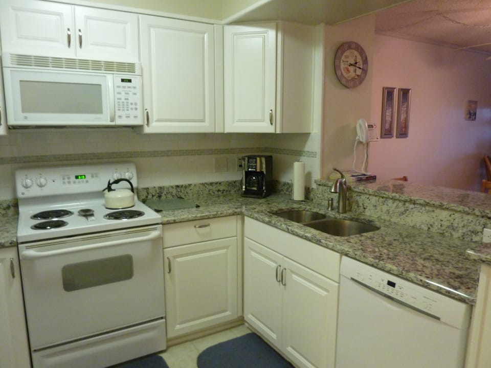 Fully equipped kitchen with tile floor