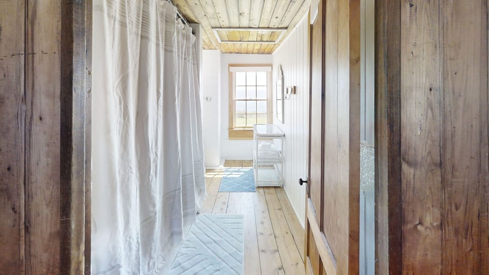 Second level full size bathroom with tub/ shower combo.
